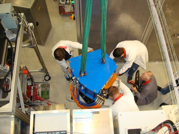 Fig. 4: The dipole magnet of the mass separator being positioned.